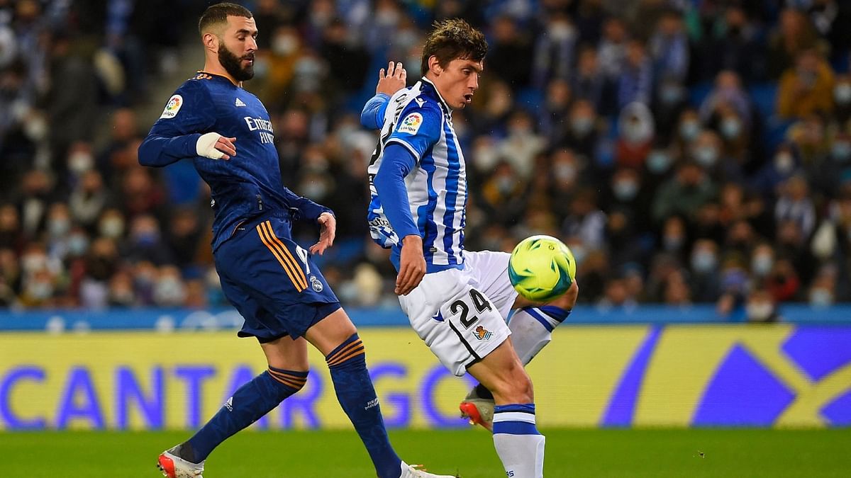 Real Madrid ease past Real Sociedad after Barca, Atletico beaten