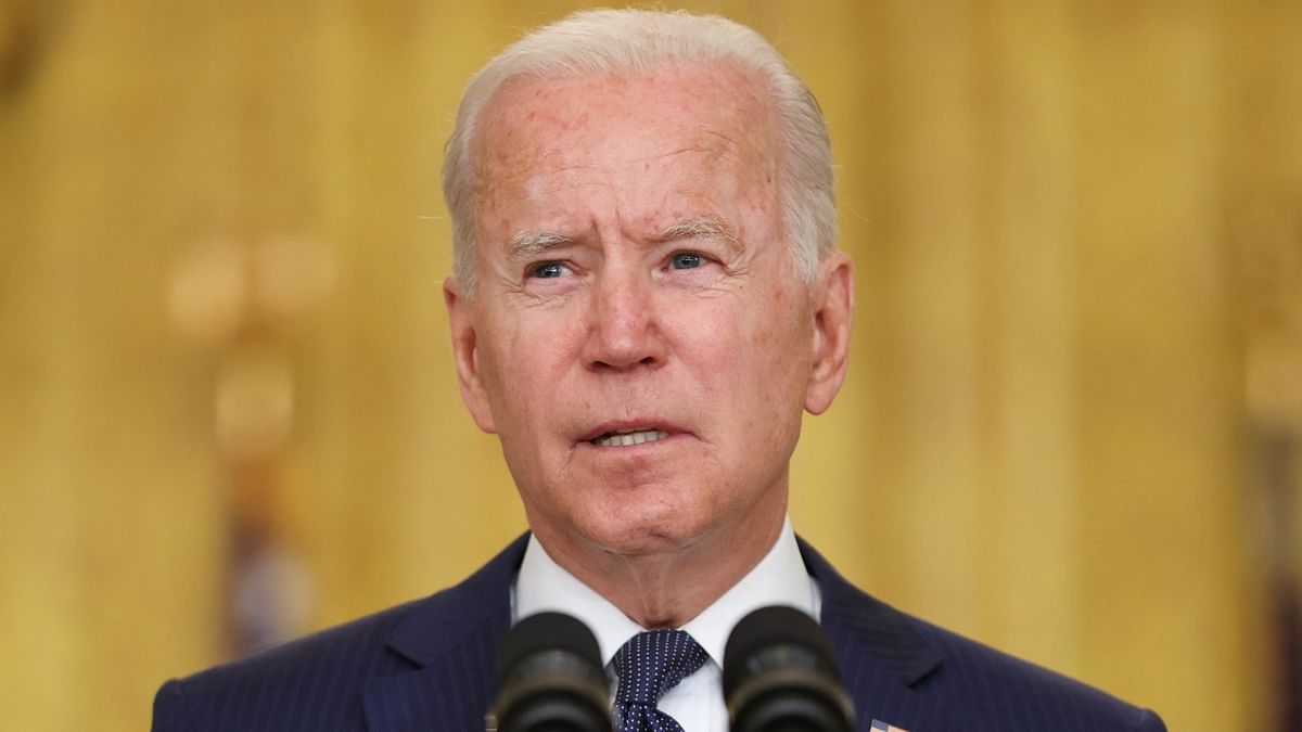 Biden signs bill banning goods from China's Xinjiang over forced labour