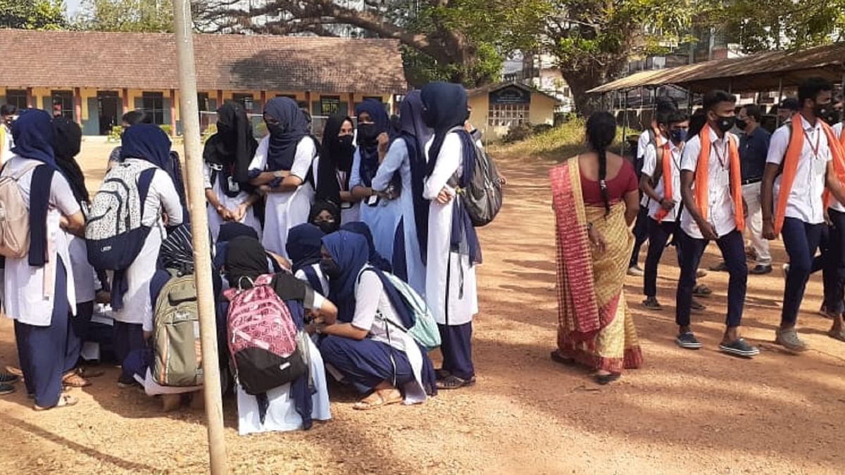 Karnataka students wear saffron shawls to colleges as hijab row escalates