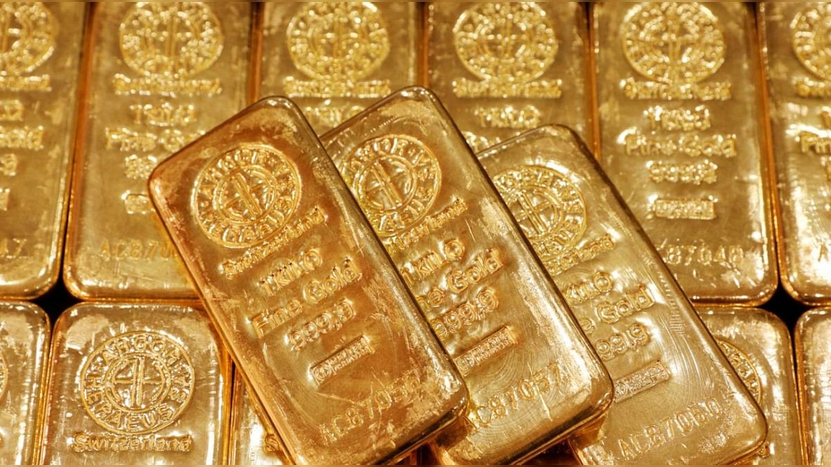 Gold slips as dollar holds firm on safe-haven flows