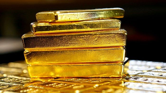 Gold slips on stronger dollar, Powell's hawkish comments