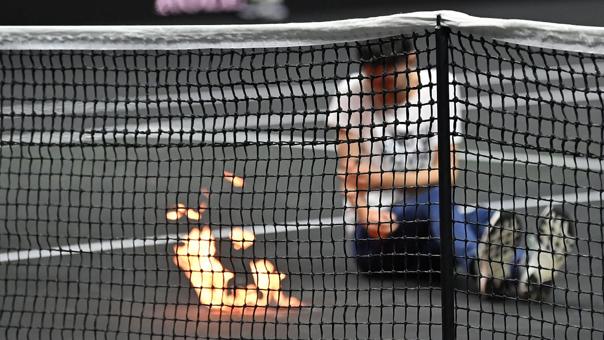 Laver Cup match between Tsitsipas and Schwartzman halted after protester sets arm on fire