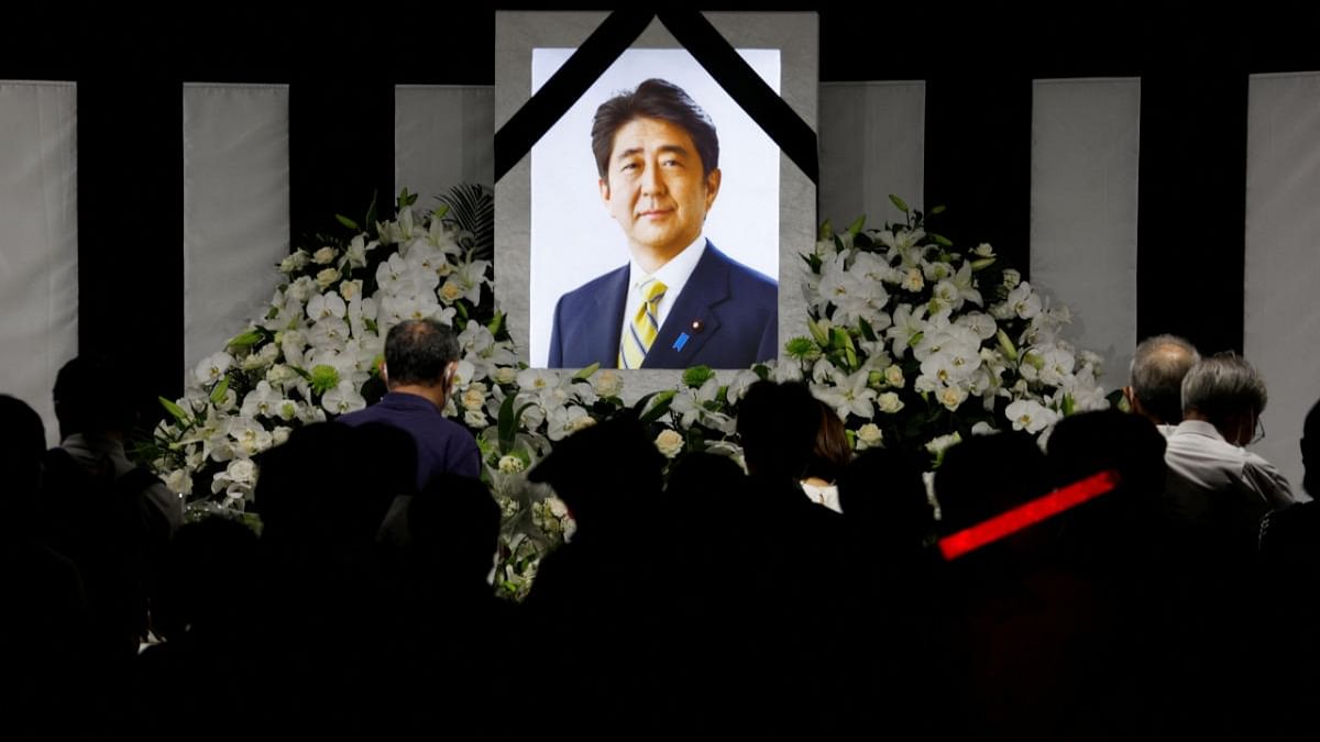 With flowers and a gun salute, Japan bids farewell to slain Shinzo Abe at state funeral