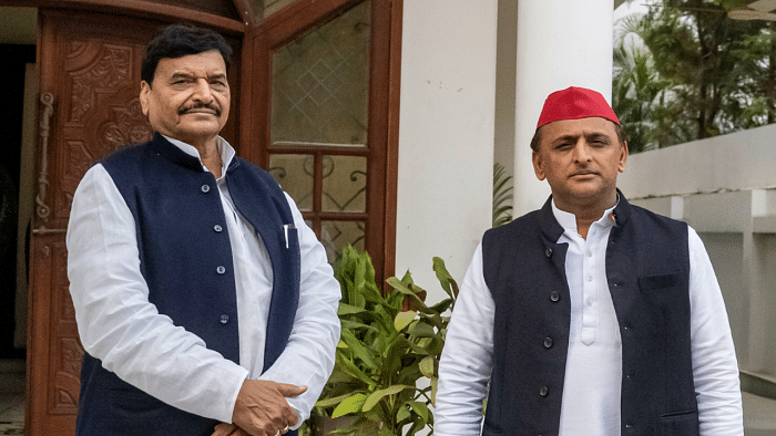 Bypoll campaign: Akhilesh Yadav touches uncle Shivpal's feet at election rally