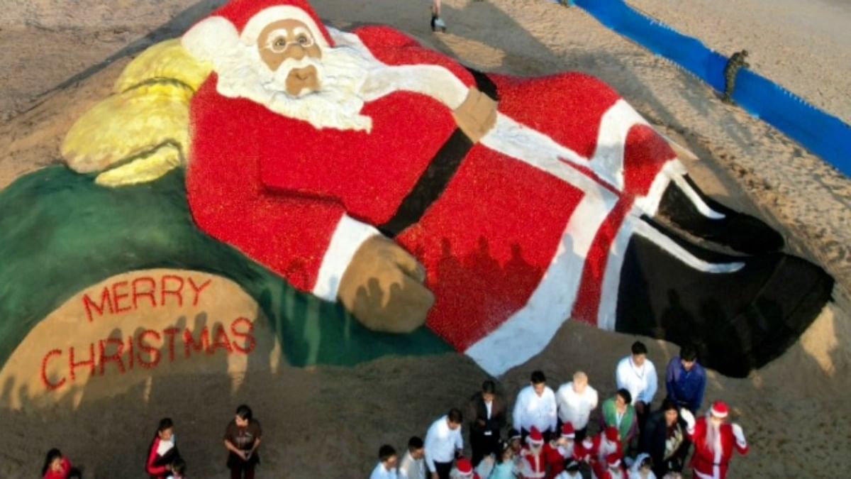 Noted sand artist creates giant Santa Claus sculpture at Odisha beach