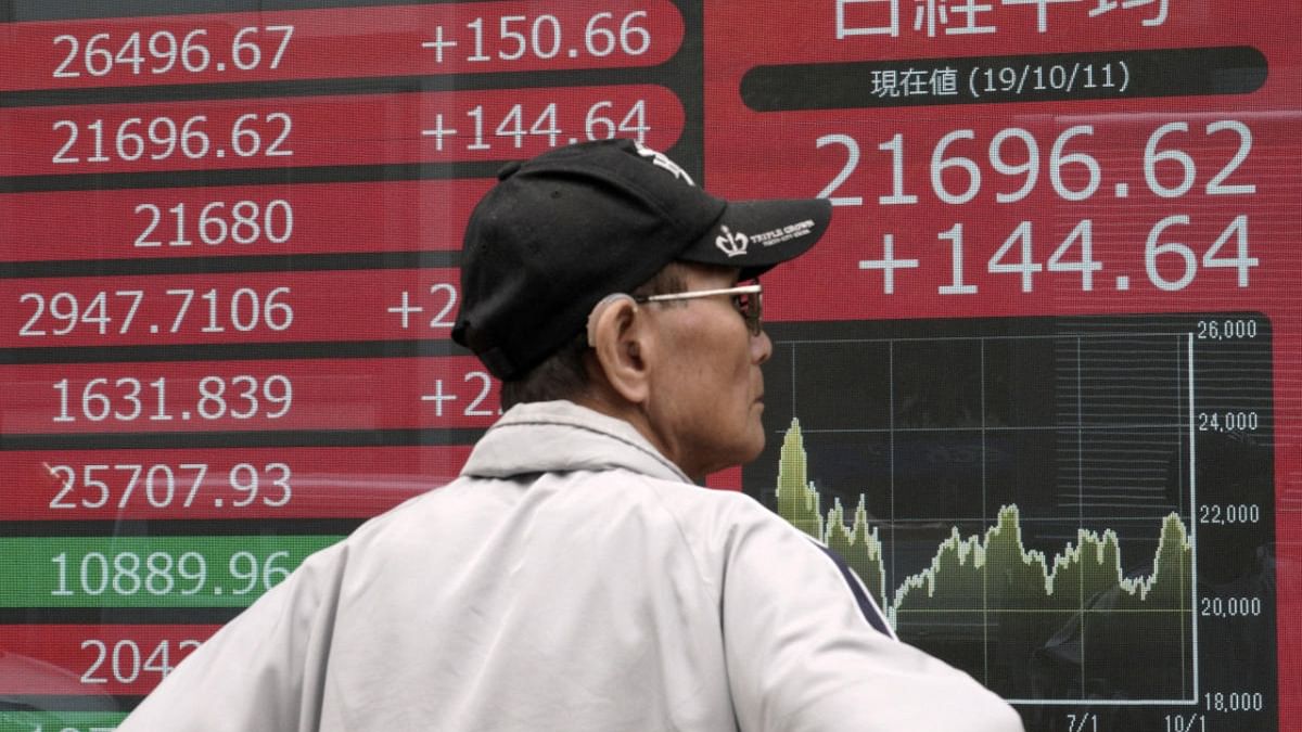 Asian markets fall as China reopening spurs inflation fears