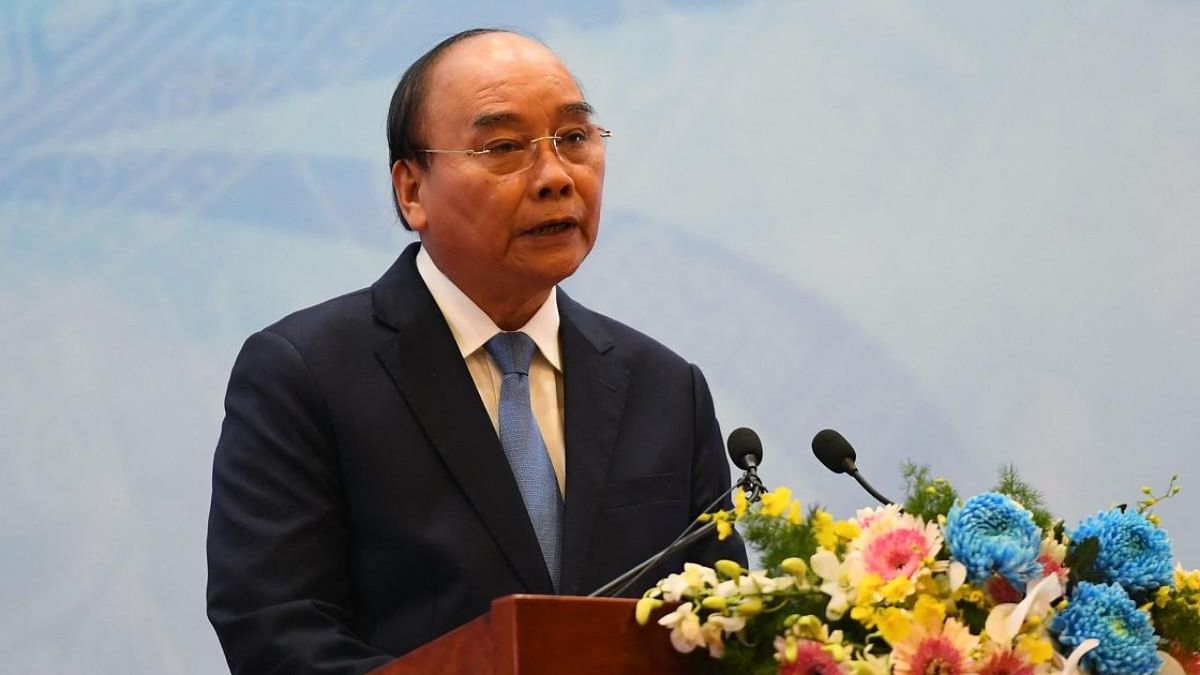 Vietnam's President Phuc quits, blamed for ministers' 'violations'