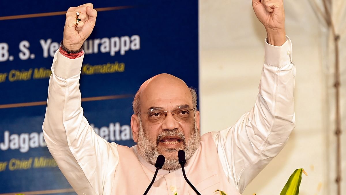 Karnataka: Amit Shah takes part in road show in Kundgol, hits out at Cong and JD(S) for dynasty politics