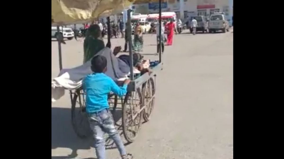 Video of boy pushing ailing man on handcart sparks outrage, officials deny 'no ambulance' claim