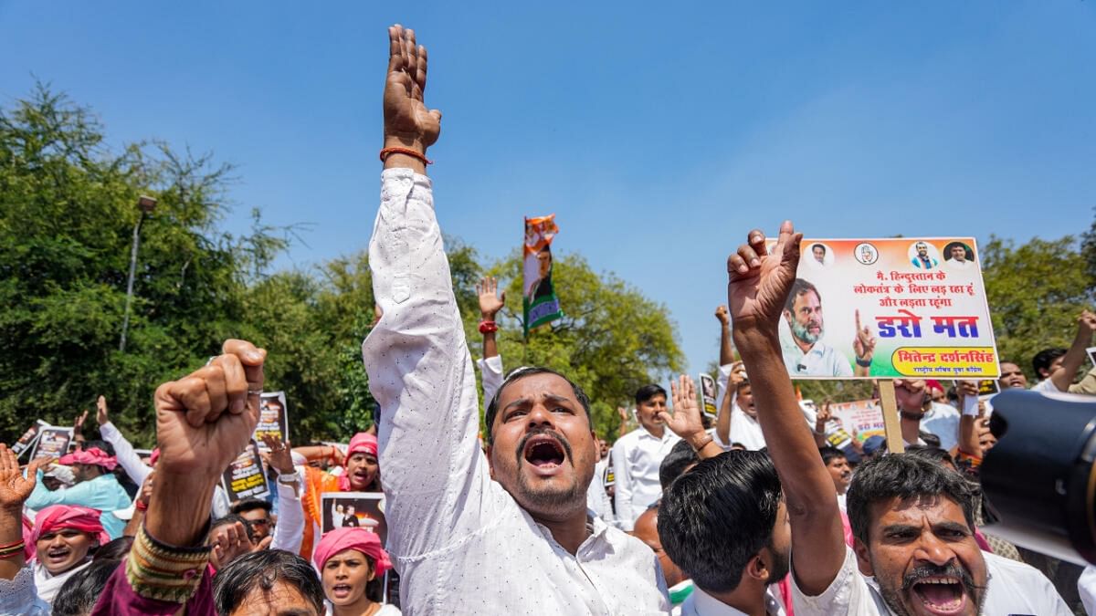 IYC members protest against Rahul Gandhi's disqualification as MP
