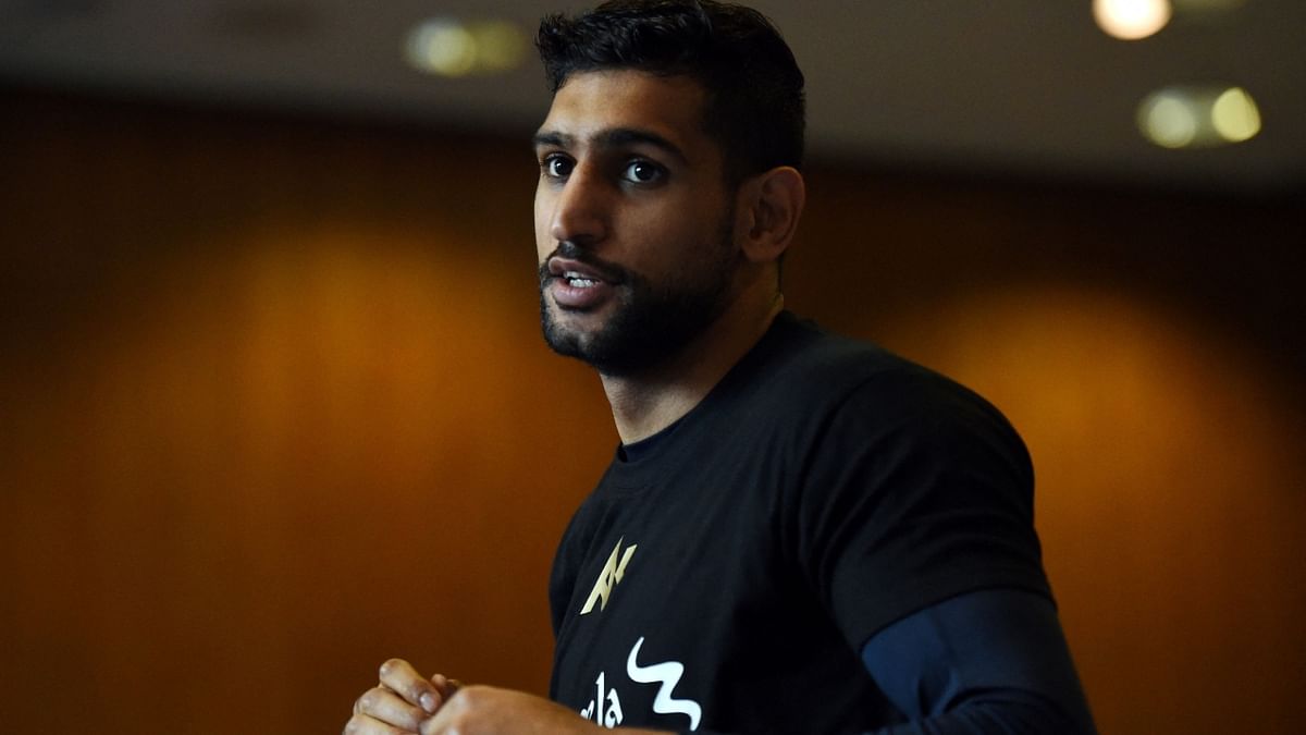 Ex-world champion Amir Khan handed two-year ban for doping