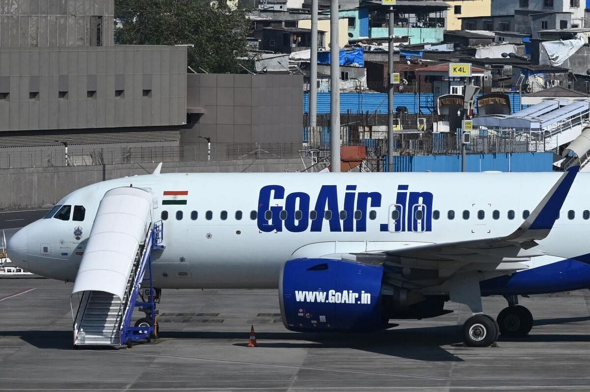 A Go First airline aircraft, formerly known as GoAir, is seen parked at the apron of the Mumbai International airport on May 3, 2023. - Debt-laden Indian budget airline Go First has filed for bankruptcy protection, blaming