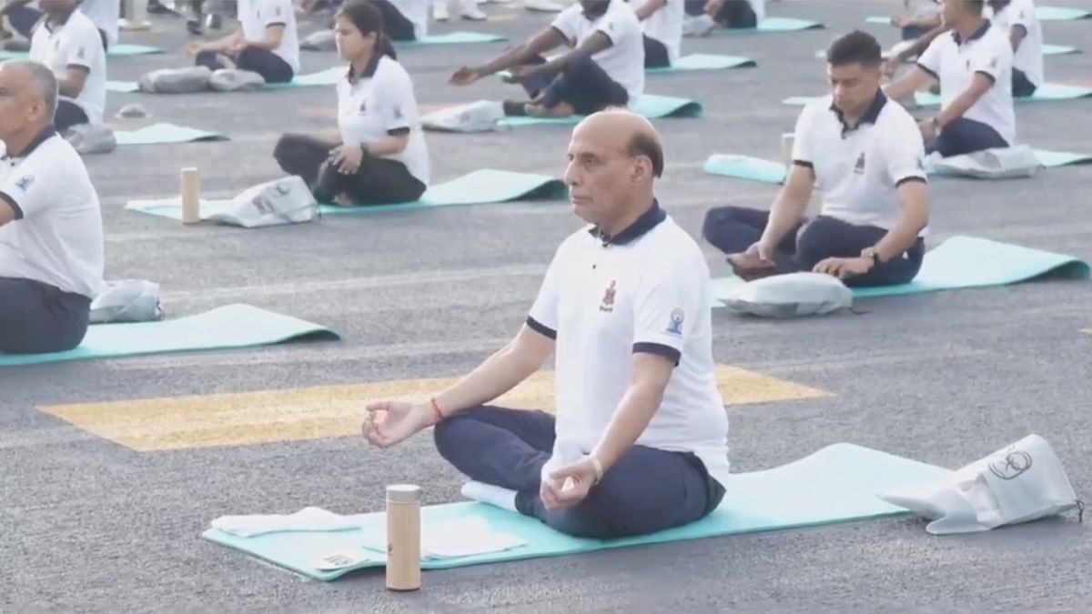 Watch: Rajnath Singh participates in International Yoga Day celebrations on board INS Vikrant