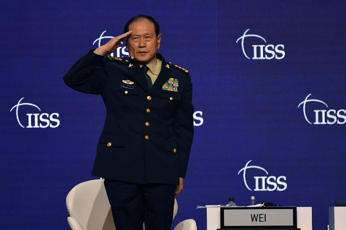 China's Defence Minister Wei Fenghe salutes at the Shangri-La Dialogue summit in Singapore. Credit: AFP Photo