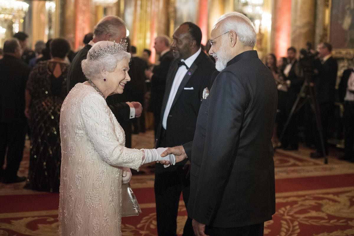 Britain's Queen Elizabeth II, greets India's Prime Minister Narendra Modi in the Blue Drawing Room at Buckingham Palace as the Queen hosts a dinner during the Commonwealth Heads of Government Meeting, in London, Thursday April 19, 2018. AP/PTI Photo