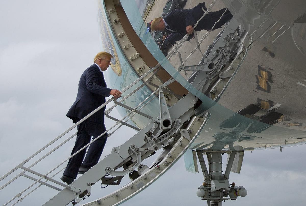 U.S. President Donald Trump boards Air Force One during his departure from Palm Beach International Airport in West Palm Beach, Fla. AP/PTI Photo