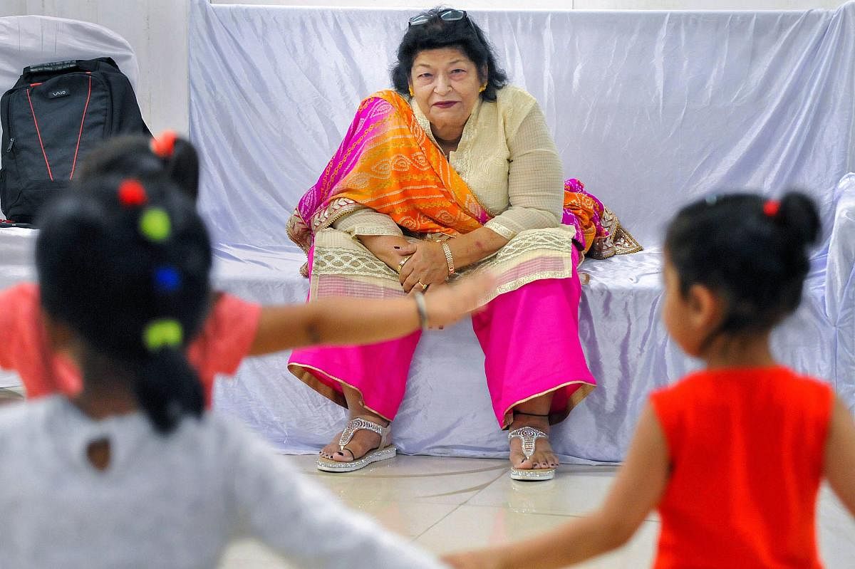 Bollywood dance director Saroj Khan teaches dance steps to students during a 12-day workshop, in Sangli on Tuesday. PTI Photo