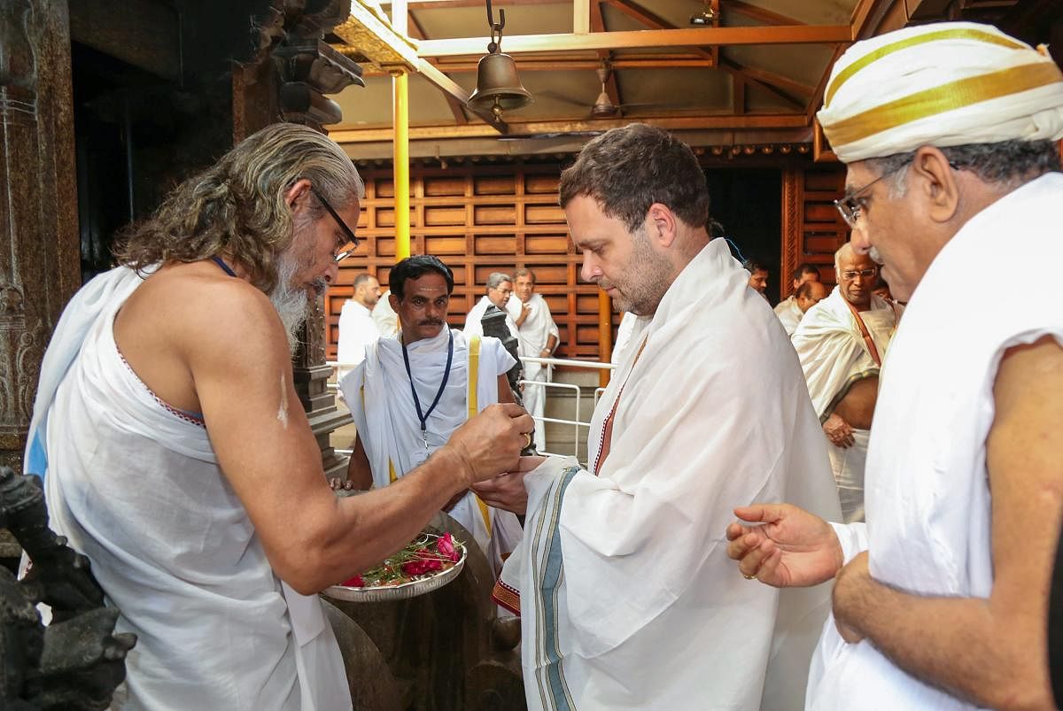 AICC President Rahul Gandhi offers prayers at Manjunatheshwara Temple during his state visit ahead of Karnataka Assembly elections in Dharmasthala on Friday. PTI Photo