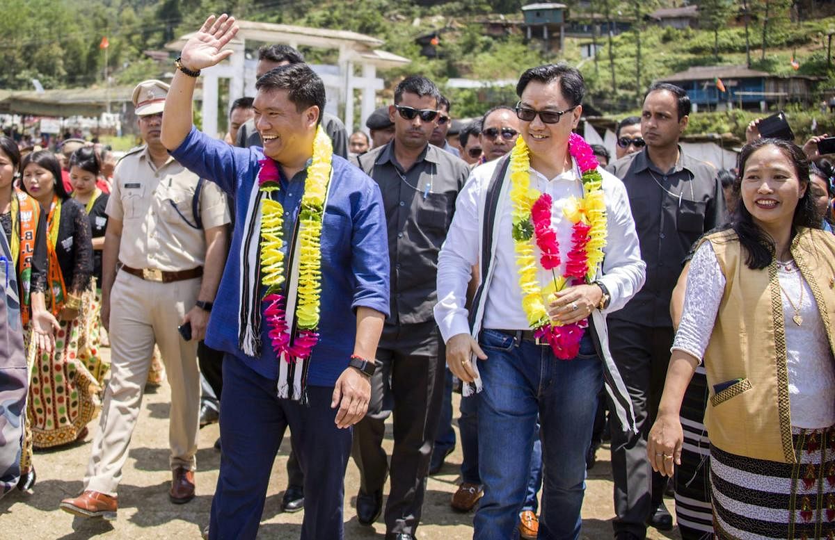 MoS for Home Kiren Rijiju (R) and Arunachal Pradesh Chief Minister Pema Khandu (L) arrive to inaugurate 36th Vivekananda Kendra Vidyalaya at Chayang Tajo on Saturday. (PTI Photo)