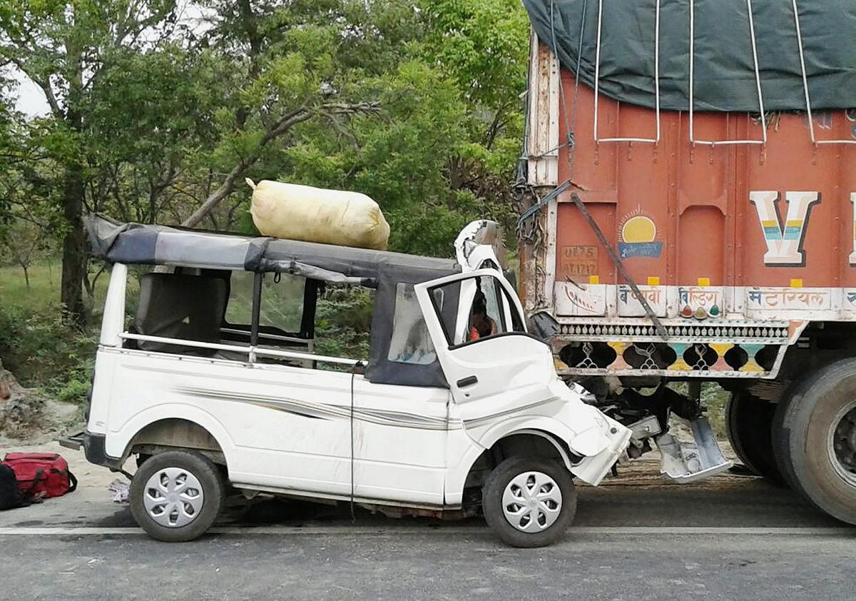 The damaged passenger van that rammed into a truck in Lakhimpur on Saturday. At least twelve people were killed and four other injured in the accident. (PTI Photo)