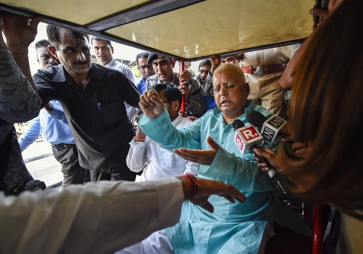 RJD Chief Lalu Prasad Yadav after being discharged from AIIMS speaks to the media on his arrival at New Delhi Railway station in New Delhi, on Monday. PTI Photo