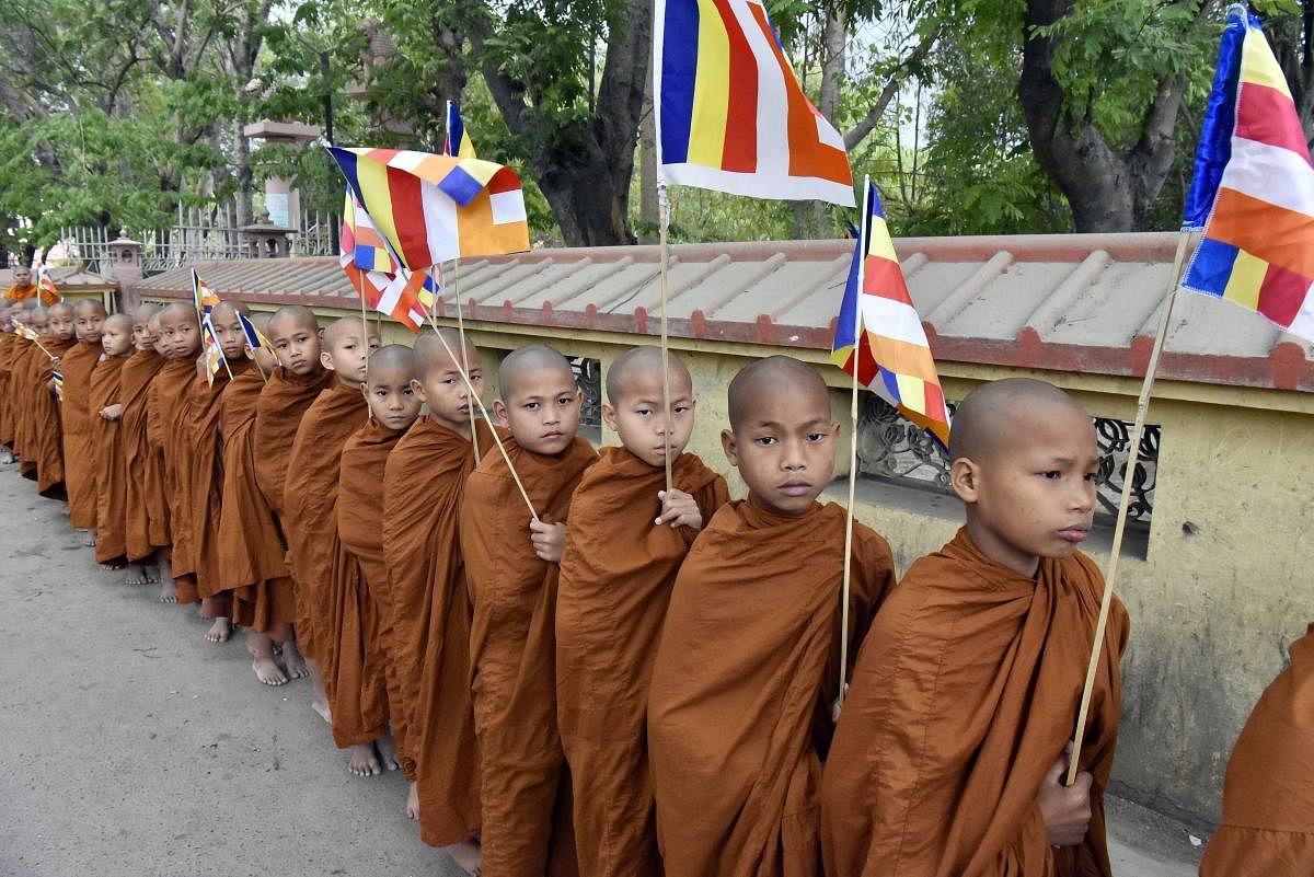 A group of novice monks from Thailand take part in a holy procession on occasion of Buddha Purnima at Bodh Gaya on Monday. PTI Photo