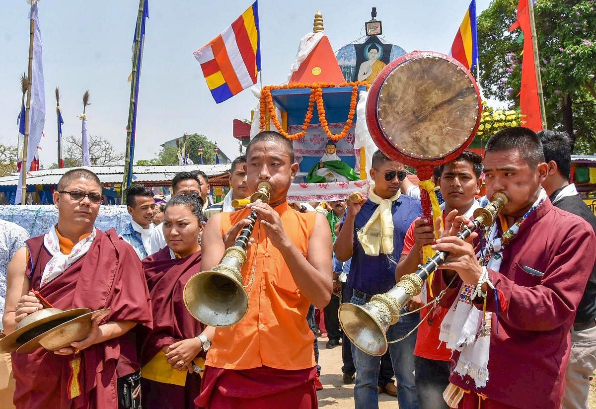 Buddhist monks take part in a holy procession on occasion of Buddha Purnima in Ranchi on Monday. PTI Photo