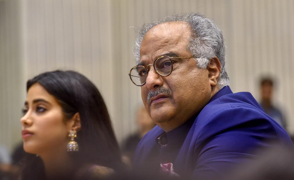 Film producer Boney Kapoor and his daughter Janhvi, during the 65th National Film Awards function at Vigyan Bhavan in New Delhi on Thursday. The family received Best Actress Award on behalf of actress Sridevi who died recently. PTI Photo