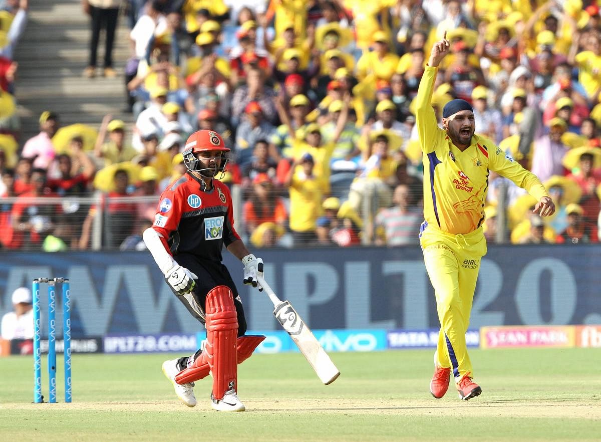Chennai Super Kings' Harbhajan Singh celebrates the dismissal of Royal Challengers Bangalore's AB de Villiers during an IPL cricket match in Pune on Saturday. PTI/BCCI