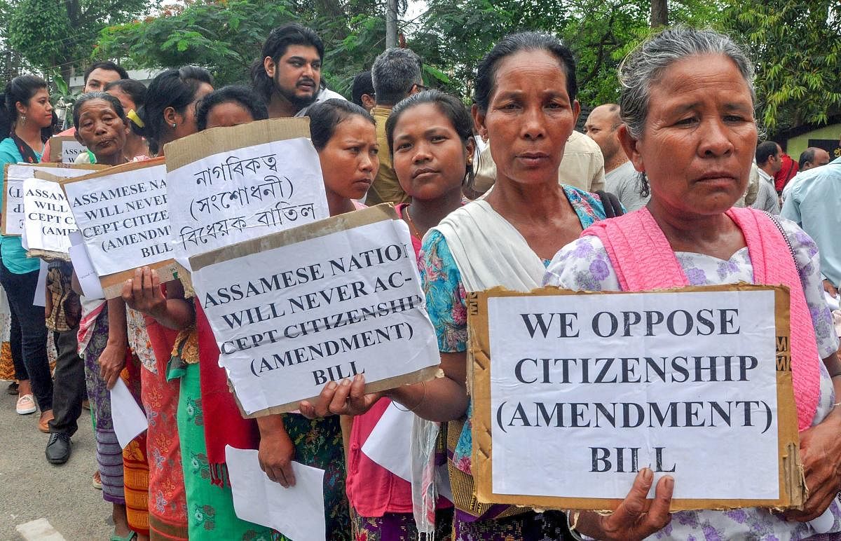 Members of different organizations and individuals hold placards against the Citizenship (Amendment) Bill, 2016 hearing by Joint Committee at the Assam Administrative Staff College, Khanapara in Guwahati on Monday. PTI
