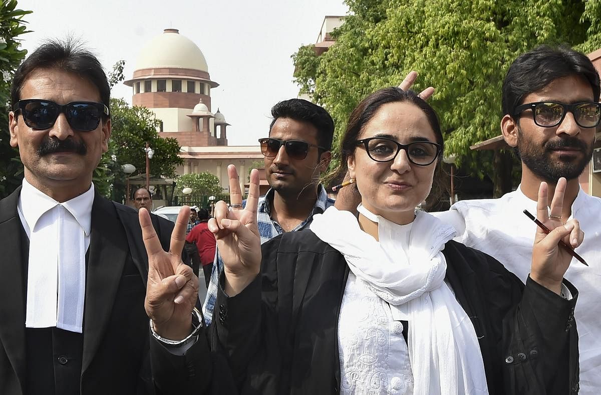 Kathua rape victim's lawyer Deepika Singh Rajawat, shows victory sign after Supreme Court directs fast-track trial and transfer of Kathua gang-rape and murder case to Pathankot in New Delhi on Monday. PTI