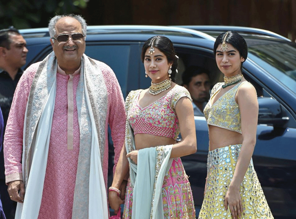 Bollywood producer Boney Kapoor and daughters Janhvi Kapoor and Khushi Kapoor arrive for Sonam Kapoor’s wedding to entrepreneur Anand Ahuja in Mumbai on Tuesday. PTI Photo by Mitesh Bhuvad