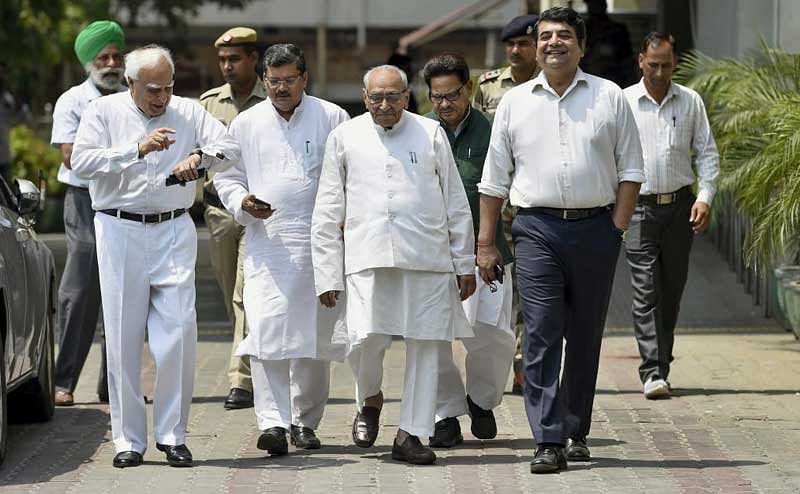 Senior Congress leaders Kapil Sibal, Motilal Vora, R P N Singh and other leaders leave after meeting with Election Commissioner of India at Nirvachan Sadan in New Delhi, on Friday. PTI