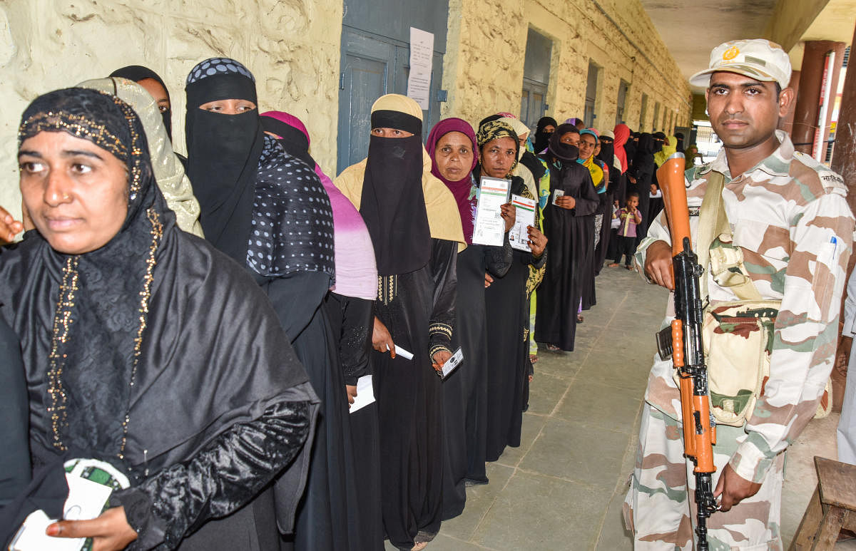 Women stand in Queue to exercise their franchise for Assembly Election at Aland polling station in Kalaburagi District on Saturday. DH Photo