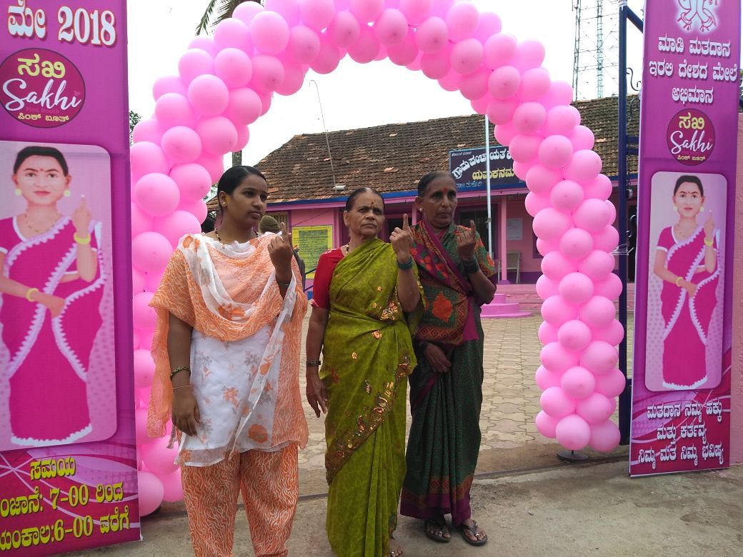 Women voters shows the indelible ink after casting their vote at a pink booth in Yamakanamaradi. DH Photo