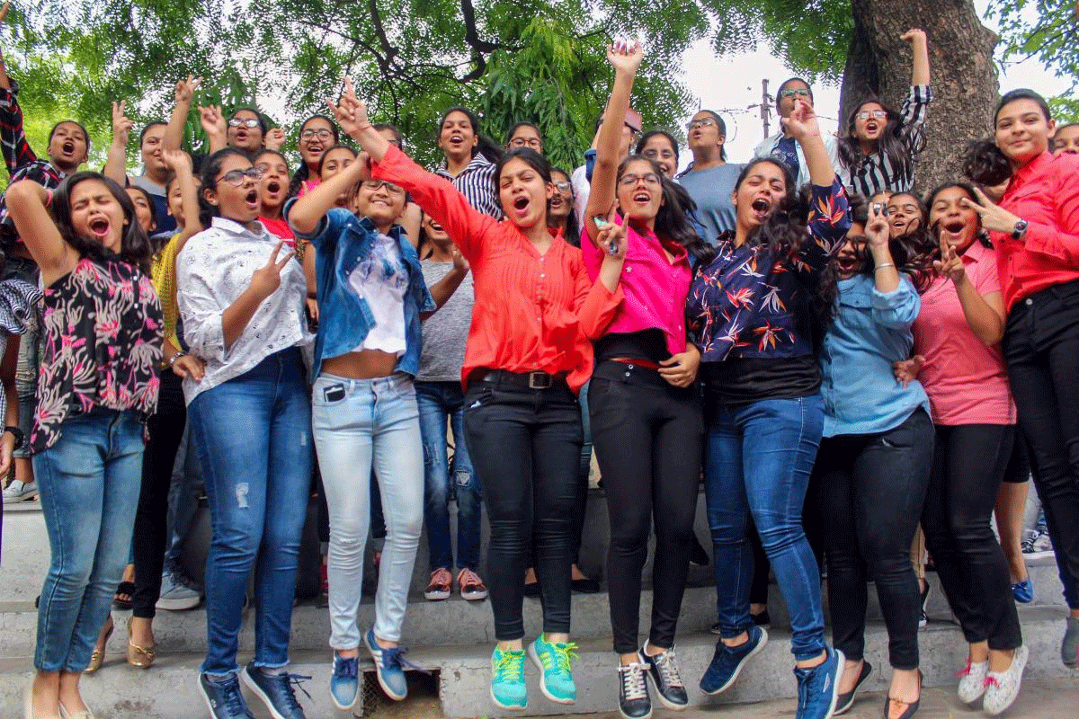 Students pose for a photograph as they celebrate after the Indian Certificate of Secondary Examination (ICSE) results of class 10th and 12th were declared, in Meerut on Monday. PTI Photo