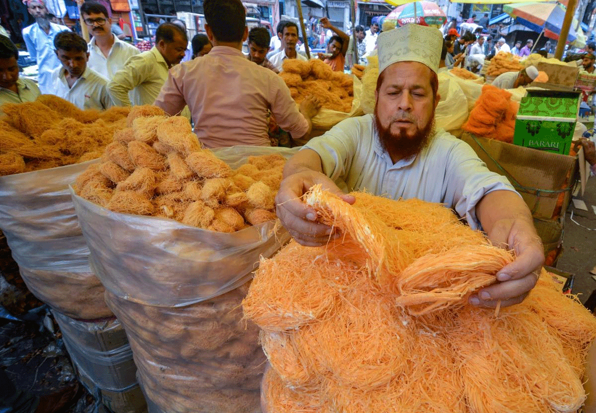 A shopkeeper arranges 'seviyan' (vermecilli) on the eve of the holy month of Ramzan, in Guwahati, on Wednesday. PTI Photo