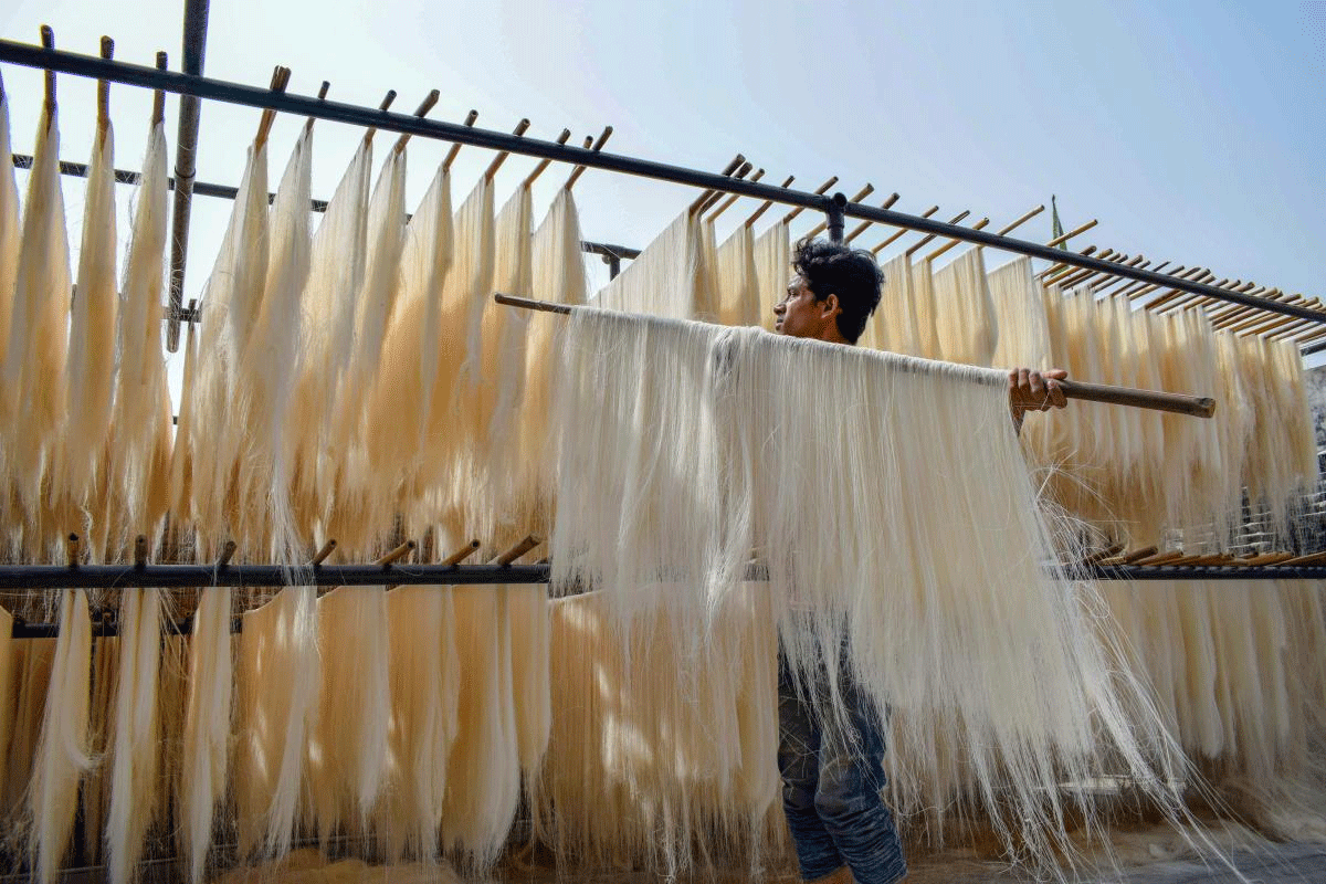 A worker makes vermicelli at a factory ahead of Muslim fasting month of Ramzan in Allahabad on Wednesday. PTI Photo