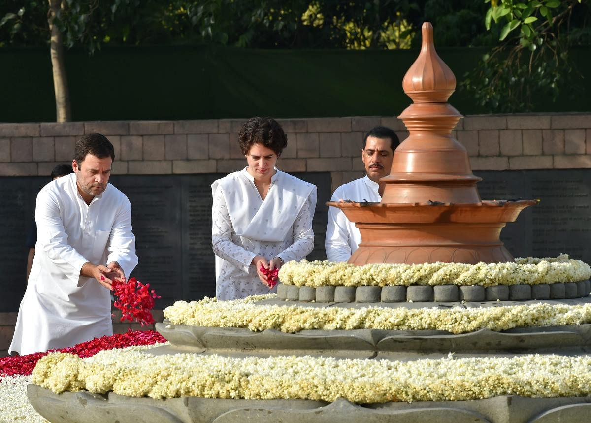 Rahul Gandhi with his sister Priyanka Gandhi-Vadra pay tribute to their father, former Prime Minister Rajiv Gandhi on his 27th death anniversary at his memorial 'Vir Bhumi' in New Delhi. PTI Photo