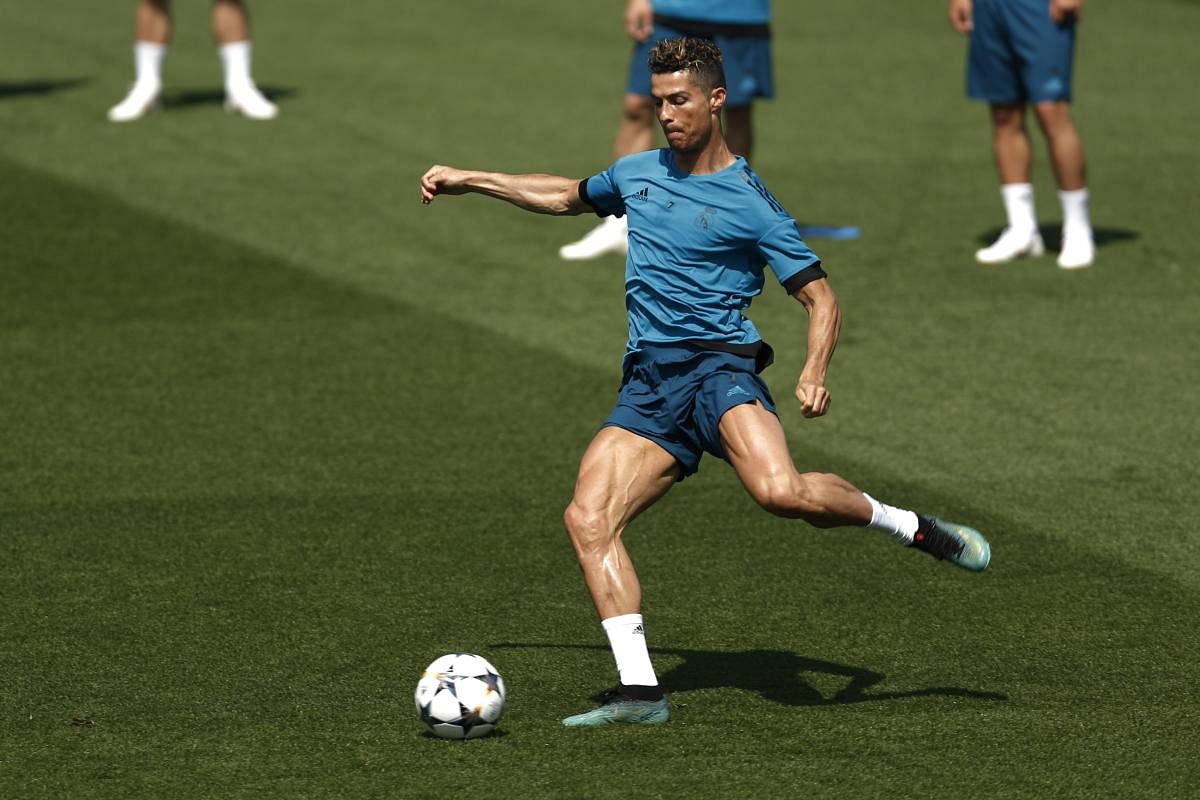 Real Madrid's Cristiano Ronaldo trains during a open media day at the team's Veldebebas training ground in Madrid. AP/PTI Photo