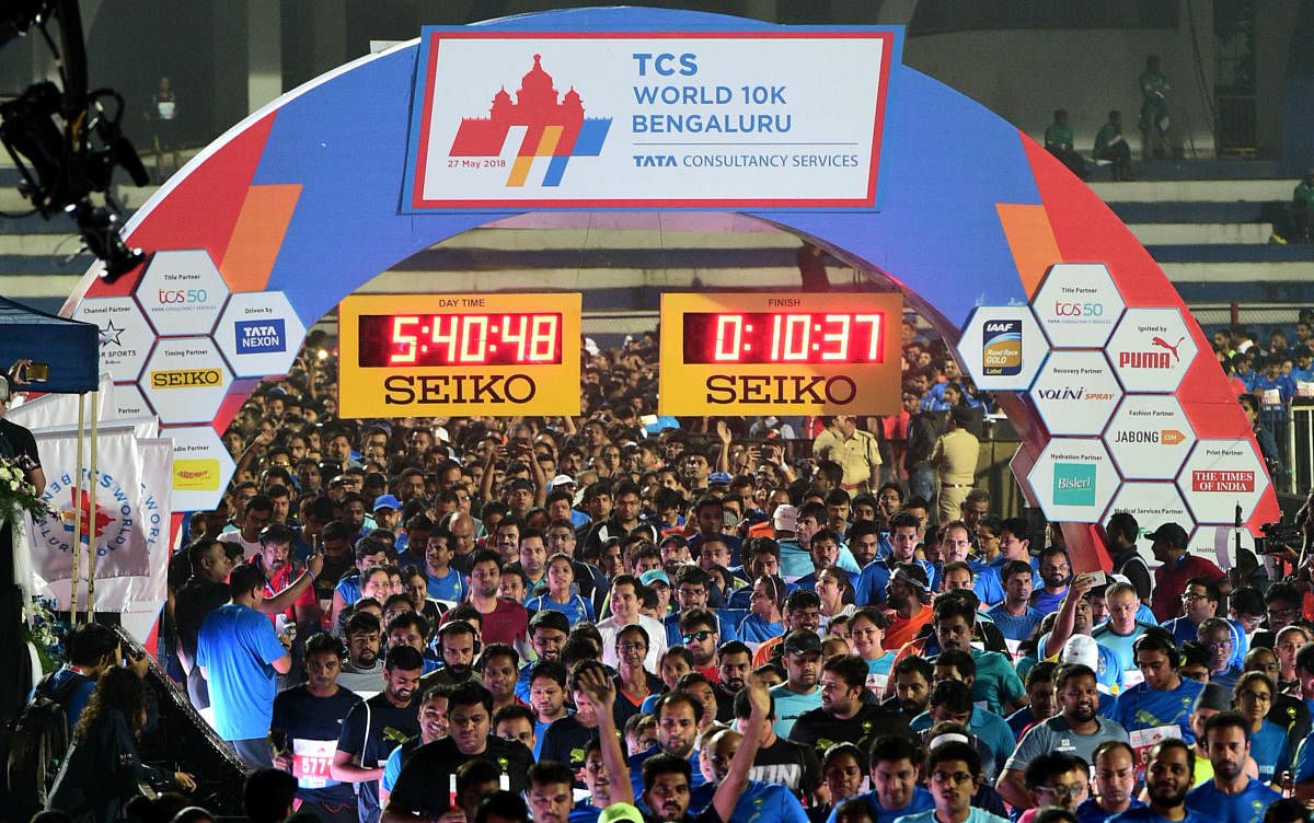 People participate in TCS world 10K Open run organised by Procam International Private Limited at Kanteerava Stadium in Bengaluru on Sunday.DH Photo