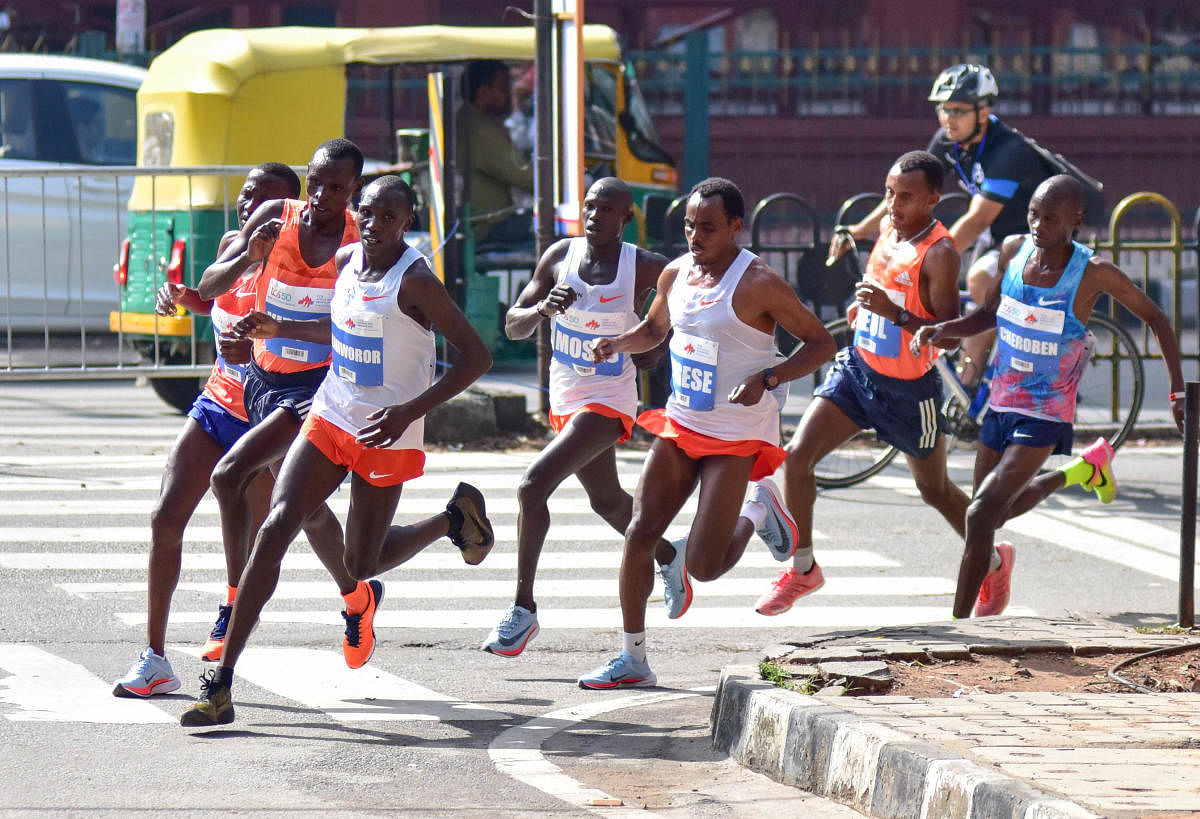 International athletes running during the elite men section marathon at M G Road for TCS World 10K run held at Sree Kanteerava Stadium in Bengaluru on Sunday.DH Photo