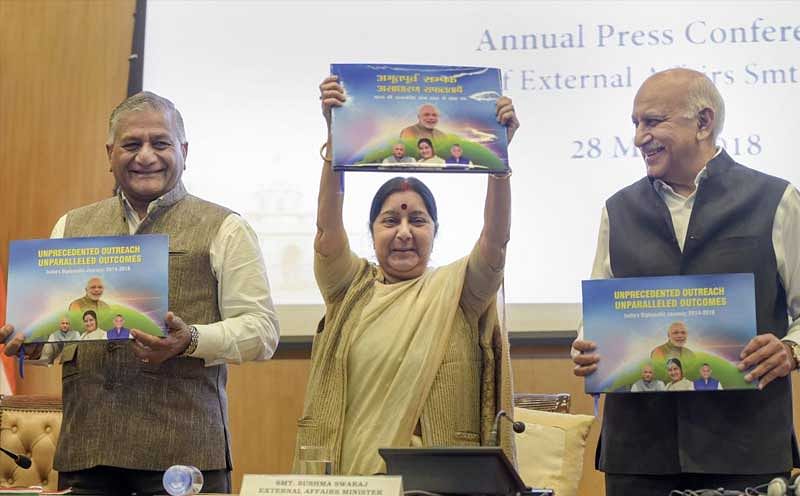 New Delhi: External Affairs Minister Sushma Swaraj (C), with Ministers of State MJ Akbar (R) and V K Singh, holds boxes which will contain books disseminating information on India, during the ministry's Annual Press Conference on completion of 4 years of the NDA government, in New Delhi on Monday, May 28, 2018. (PTI Photo)