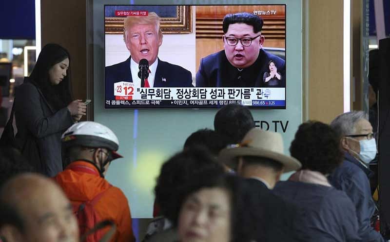Seoul : People watch a TV screen showing images of U.S. President Donald Trump, left, and North Korean leader Kim Jong Un during a news program at the Seoul Railway Station in Seoul, South Korea, Tuesday, May 29, 2018. A team of American diplomats involved in preparatory discussions with North Korea ahead of a potential summit between Trump and Kim left a hotel in Seoul on Tuesday amid speculation that they are resuming the talks. The signs read: