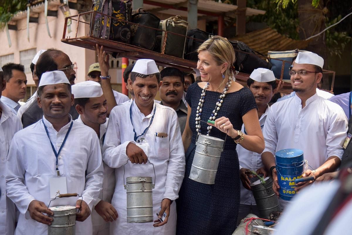 Mumbai: Queen Maxima of the Netherlands interacts with the Dabbawalas, in Mumbai on Wednesday, May 30, 2018. (PTI Photo)