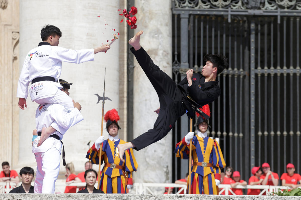 Taekwondo athletes from Korea perform for Pope Francis during the Wednesday general audience in Saint Peter's square at the Vatican, May 30, 2018. REUTERS/Max Rossi