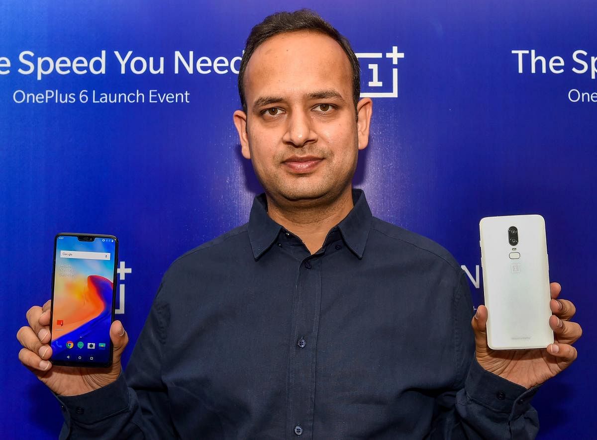 OnePlus India GM Vikas Agarwal poses for a photo with the company's mobile phones during a press conference, in Lucknow on Friday, June 22, 2018. PTI