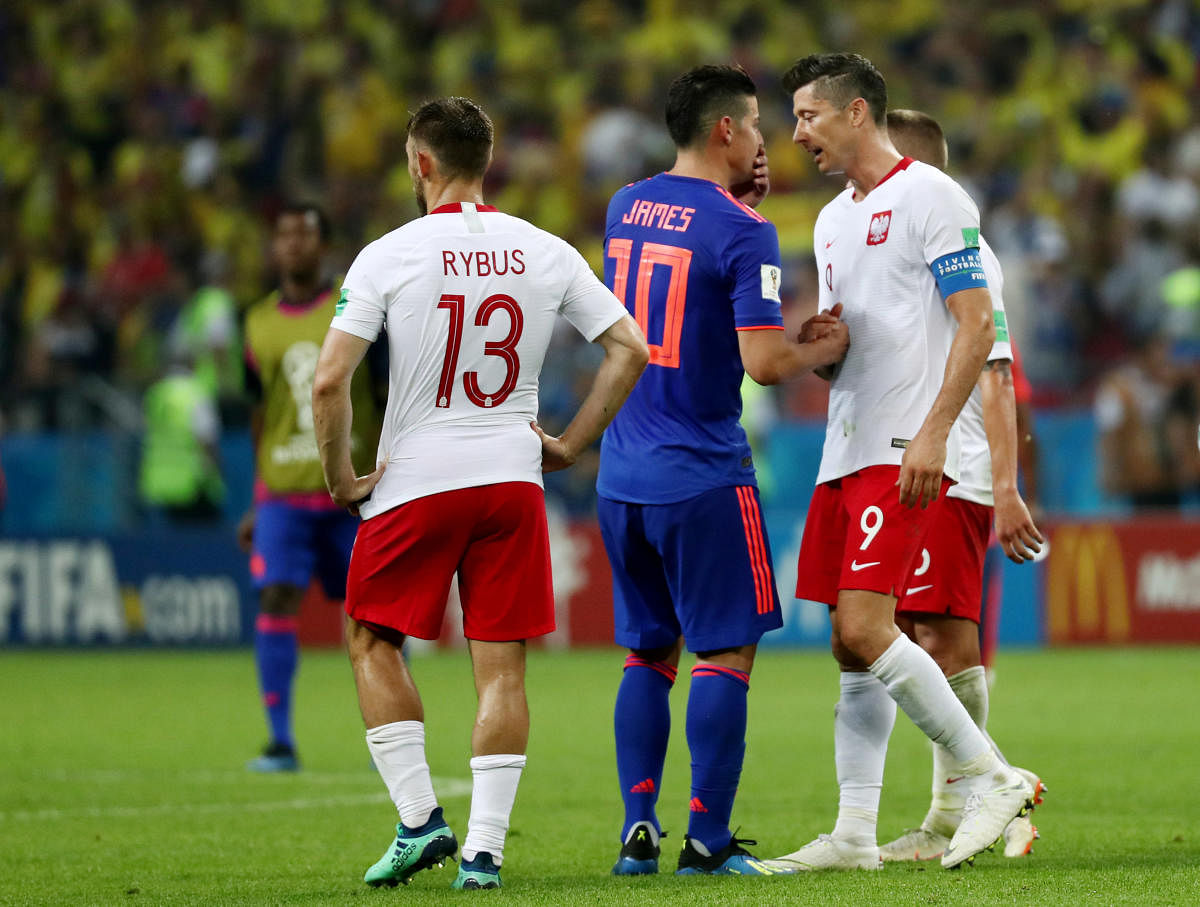 World Cup - Group H - Poland vs Colombia - Kazan Arena, Kazan, Russia - June 24, 2018 Poland's Robert Lewandowski shakes hands with Colombia's James Rodriguez at the end of the match. Reuters