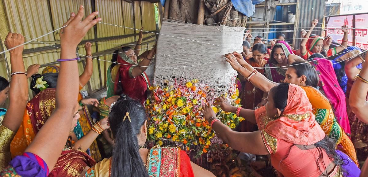 Married women perform rituals as they celebrate Vat Purnima, in Mumbai on Wednesday, June 27, 2018. PTI