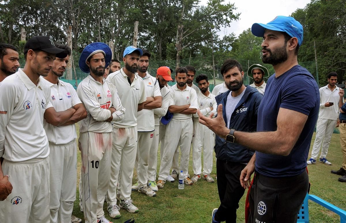 Indian cricketers Irfan Pathan and Parvez Rasool interact with aspiring cricketers during a special training session for Kashmiri youth, in Srinagar on Thursday, June 28, 2018. PTI